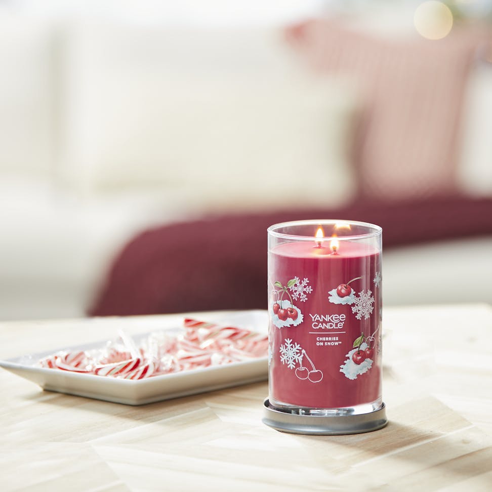 cherries on snow signature large tumbler candle on table