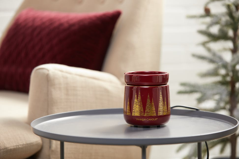 golden pines wax melt warmer on table