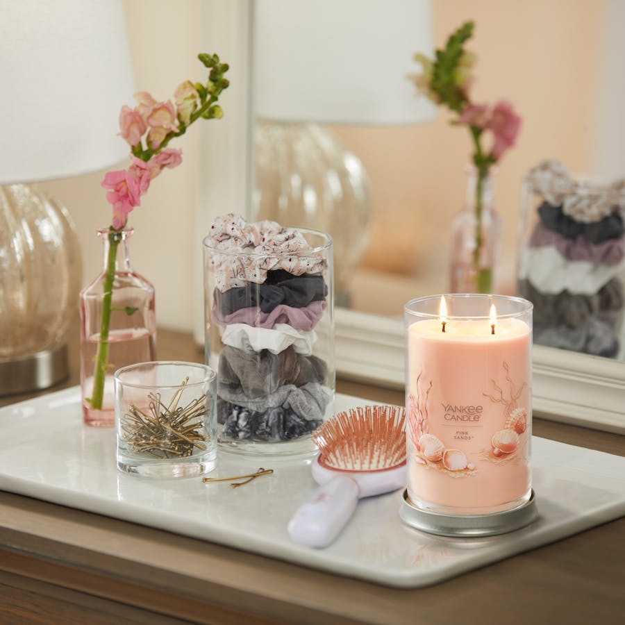 pink sands signature large tumbler candle on dresser