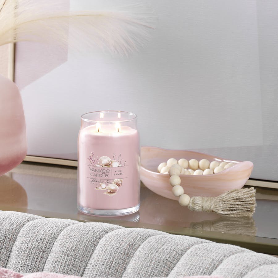 pink sands signature large jar candle on table