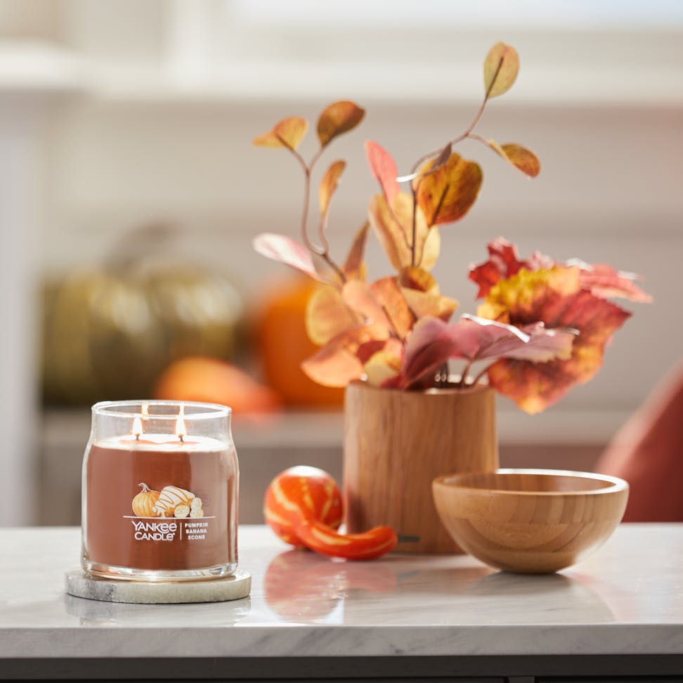 pumpkin banana scone signature medium jar candle in kitchen