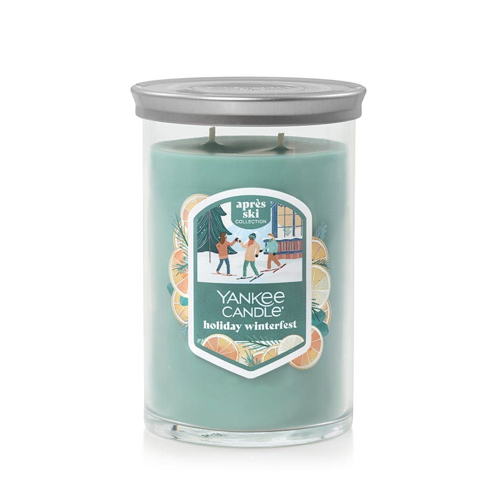 large tumbler candle with lid in holiday winterfest