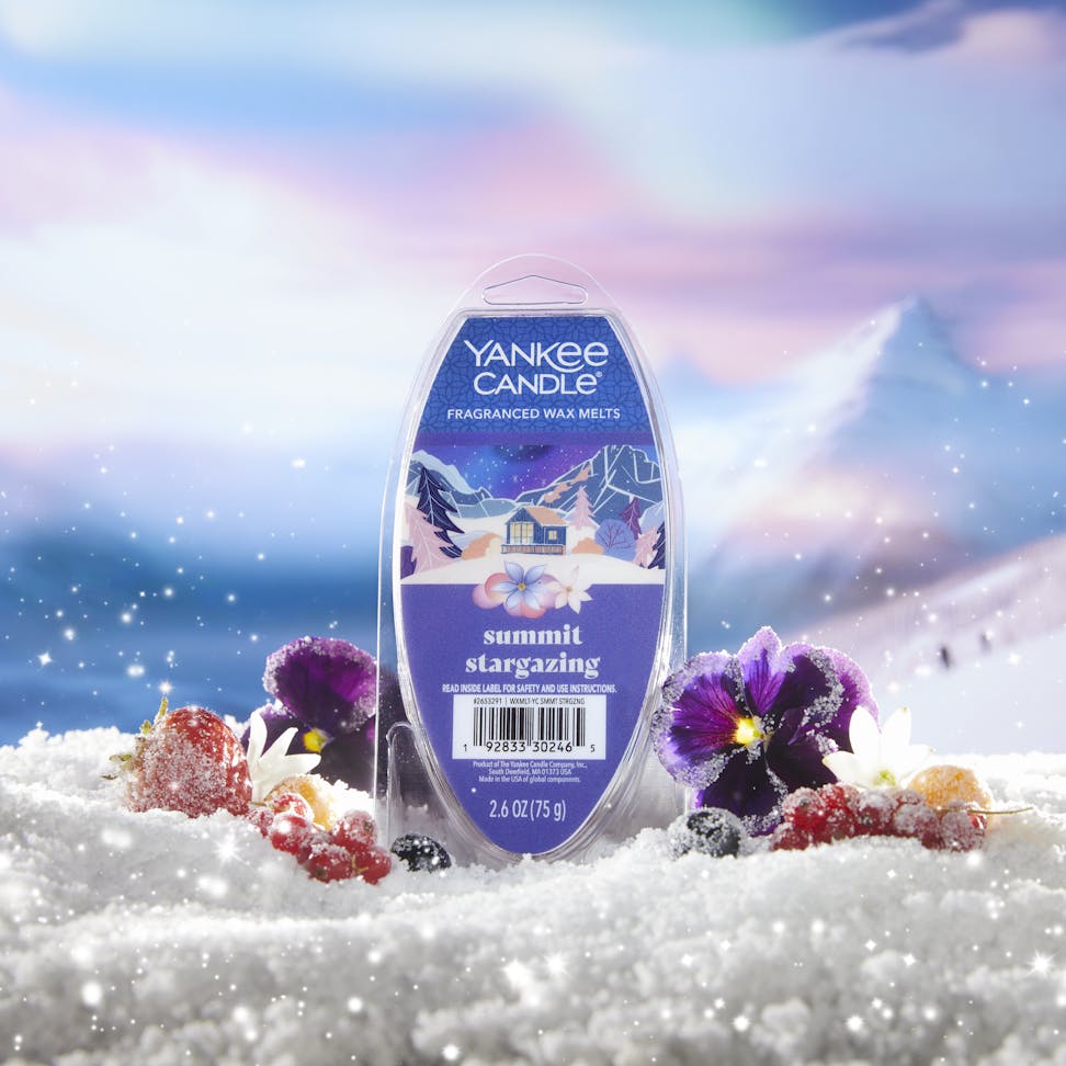 summit stargazing wax melts package on snowy surface with flowers and berries and with mountains in distance