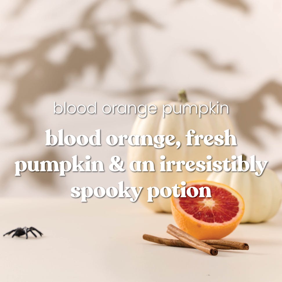 Scented candle with blood orange, pumpkin, cinnamon, and spooky Halloween decor, text highlights fragrance notes