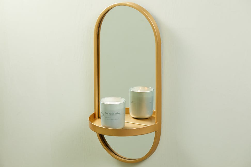 chesapeake bay candle intentions collection be reflective cucumber matcha medium two wick jar candle on a sconce