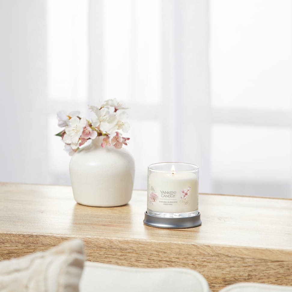 sakura blossom festival signature small tumbler candle on table
