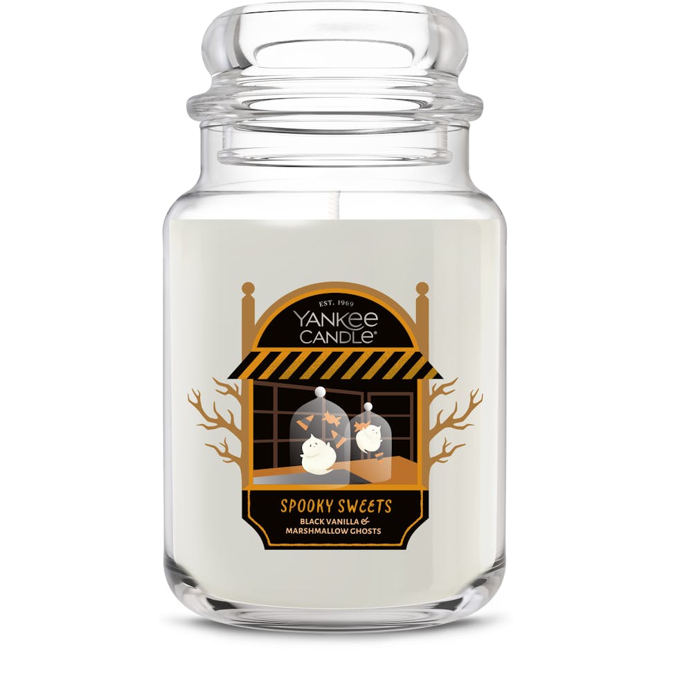 Large glass jar candle with Halloween marshmallow ghost design and spooky sweets label for home decor.