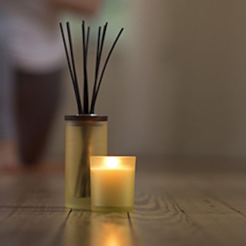 scented candle and reeds