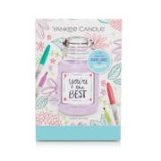 a create your own one-of-a-kind candle label gift set with a candle and a colorful flower design on the front