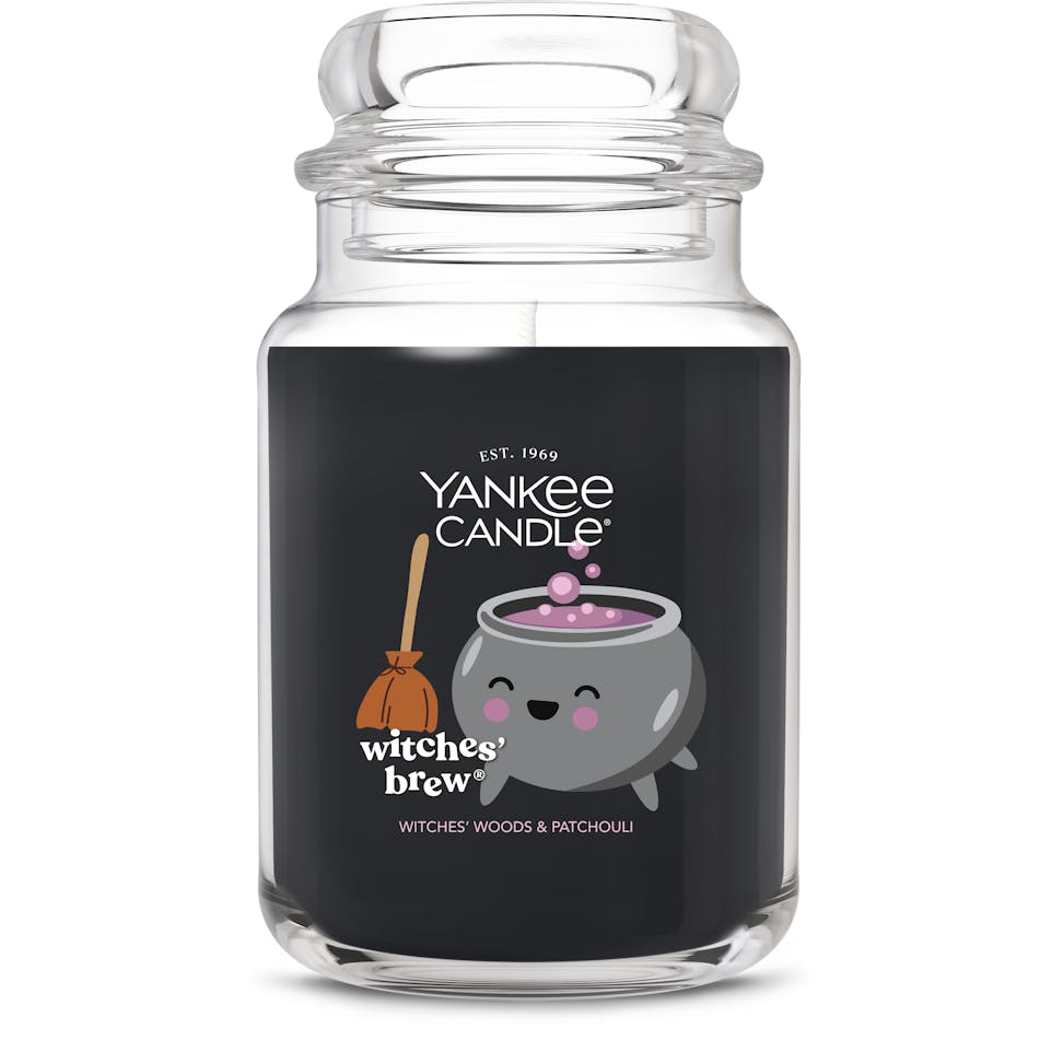Large black glass candle jar with cute cauldron and broom illustration, labeled witches brew, home decor gift
