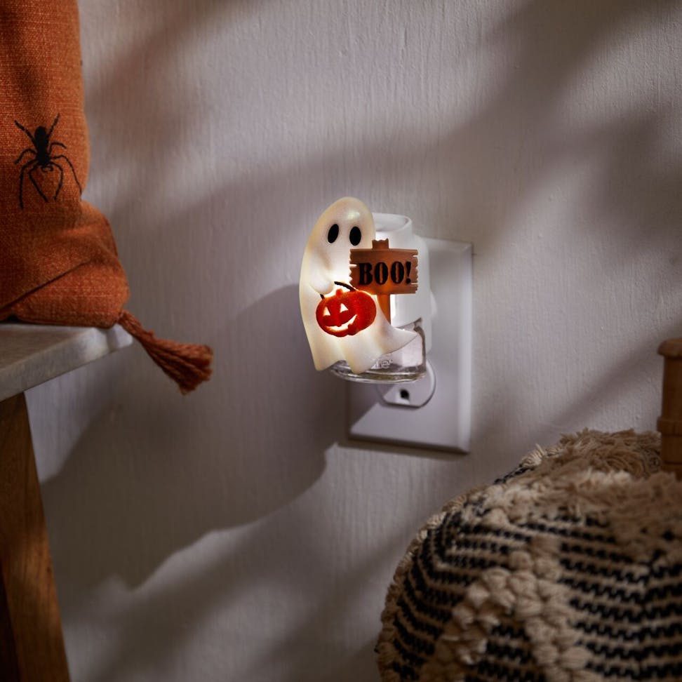 Halloween ghost night light plug-in with pumpkin and BOO sign adds spooky decor to any room or hallway.
