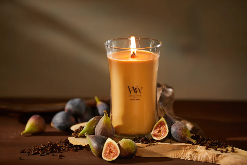 WoodWick Enchanted Destinations Collection Gilded Sands Large Hourglass Candle on a table