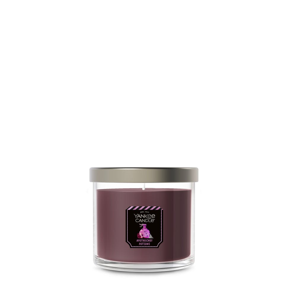 Large purple soy wax candle in clear glass jar with silver lid, perfect for home decor and relaxation ambiance