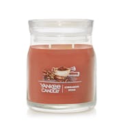 cinnamon stick signature two wick medium jar candle with lid on transparent background