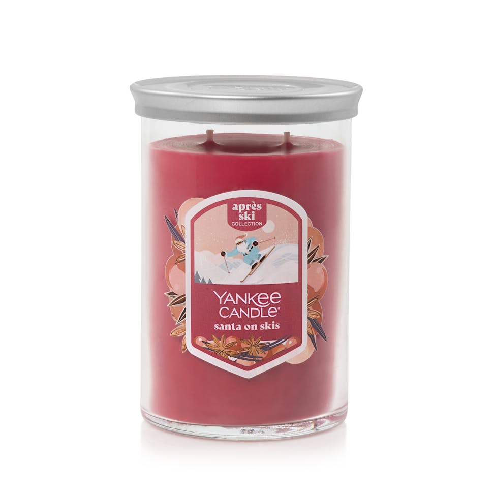 large tumbler candle in santa on skis