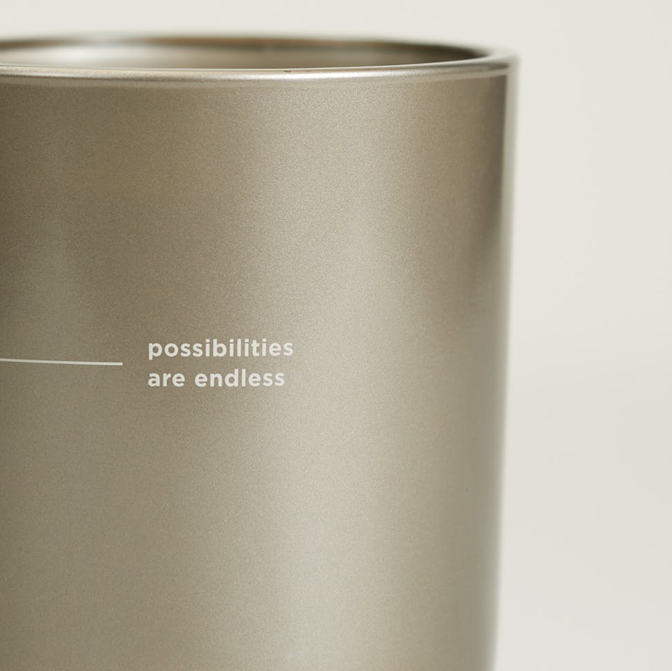 chesapeake bay candle intentions collection be curious black birch cedar medium two wick candle in a white backdrop