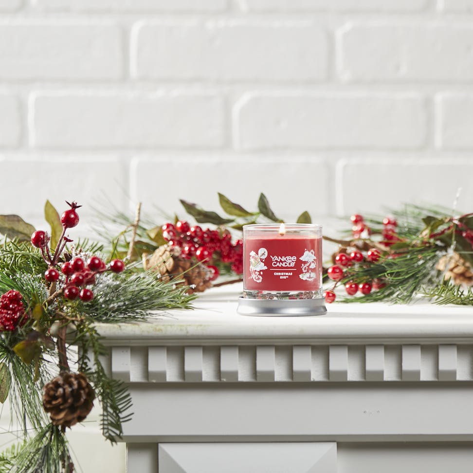 christmas eve signature small tumbler candle on mantle
