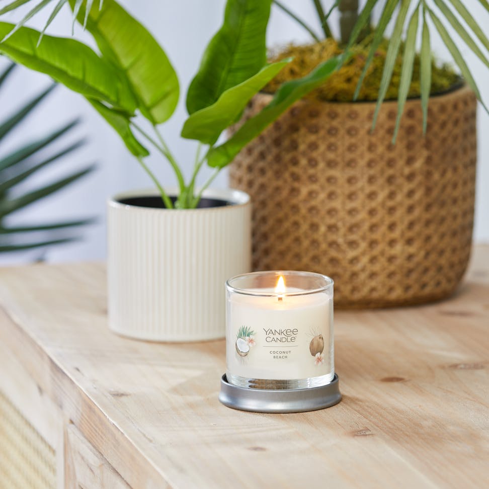 coconut beach signature small tumbler candle on table