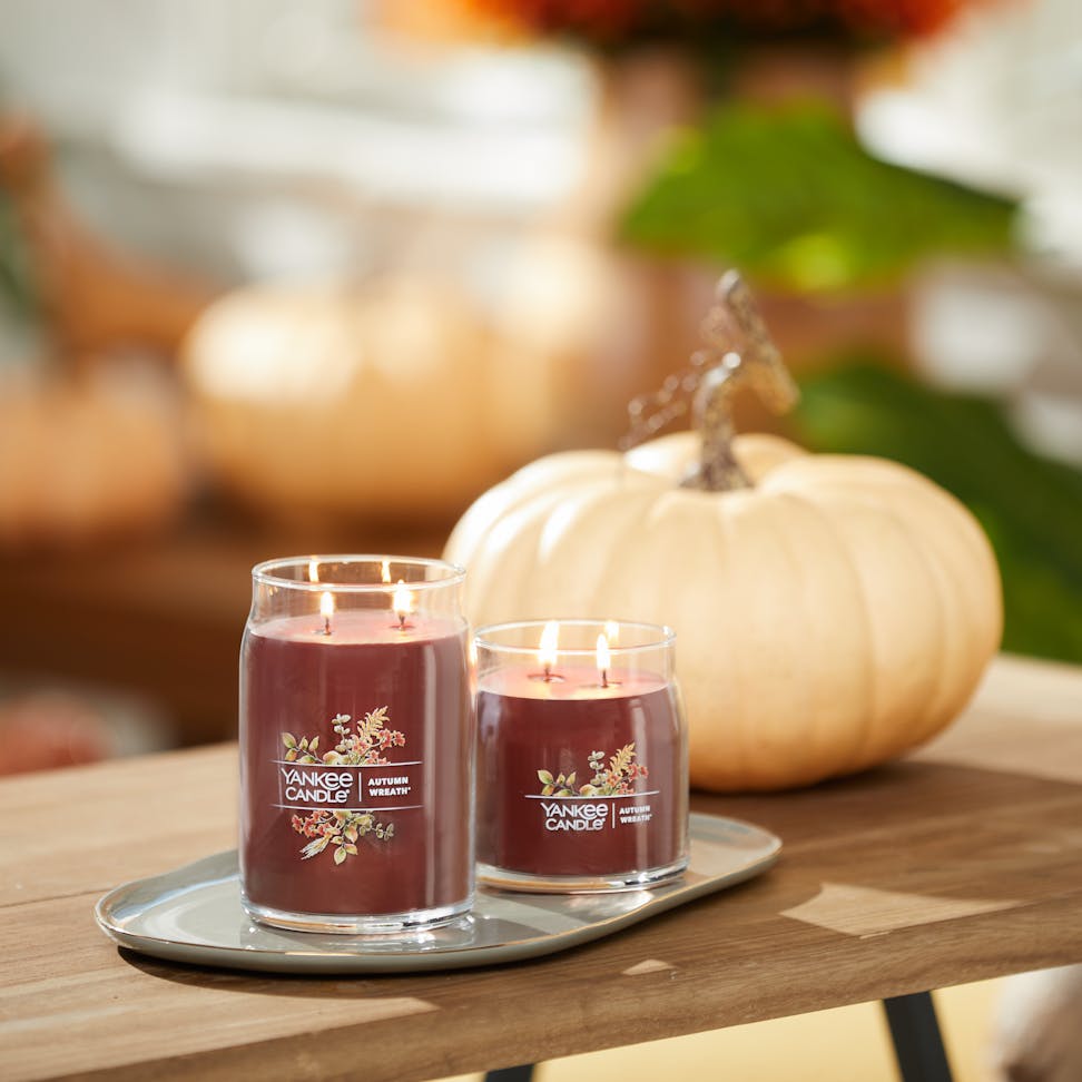 autumn wreath signature large and medium jar candles on table