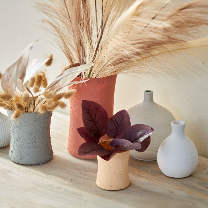 empty candle holders turned into potpourri holders