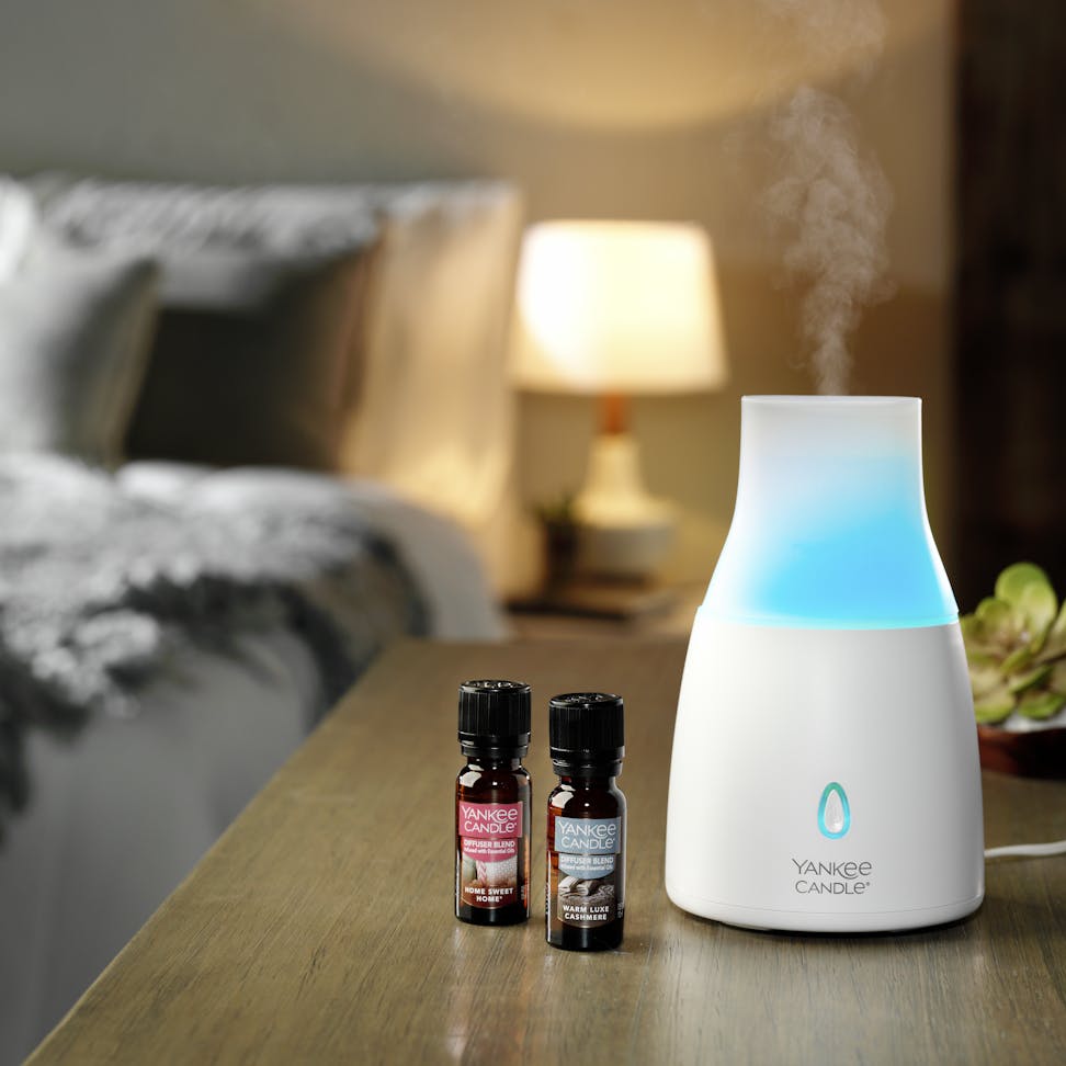 ultrasonic diffuser with home sweet home and warm luxe cashmere diffuser blends in bedroom