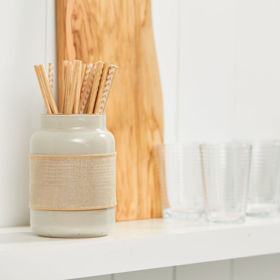 original large jar candle upcycled into holder for paper straws