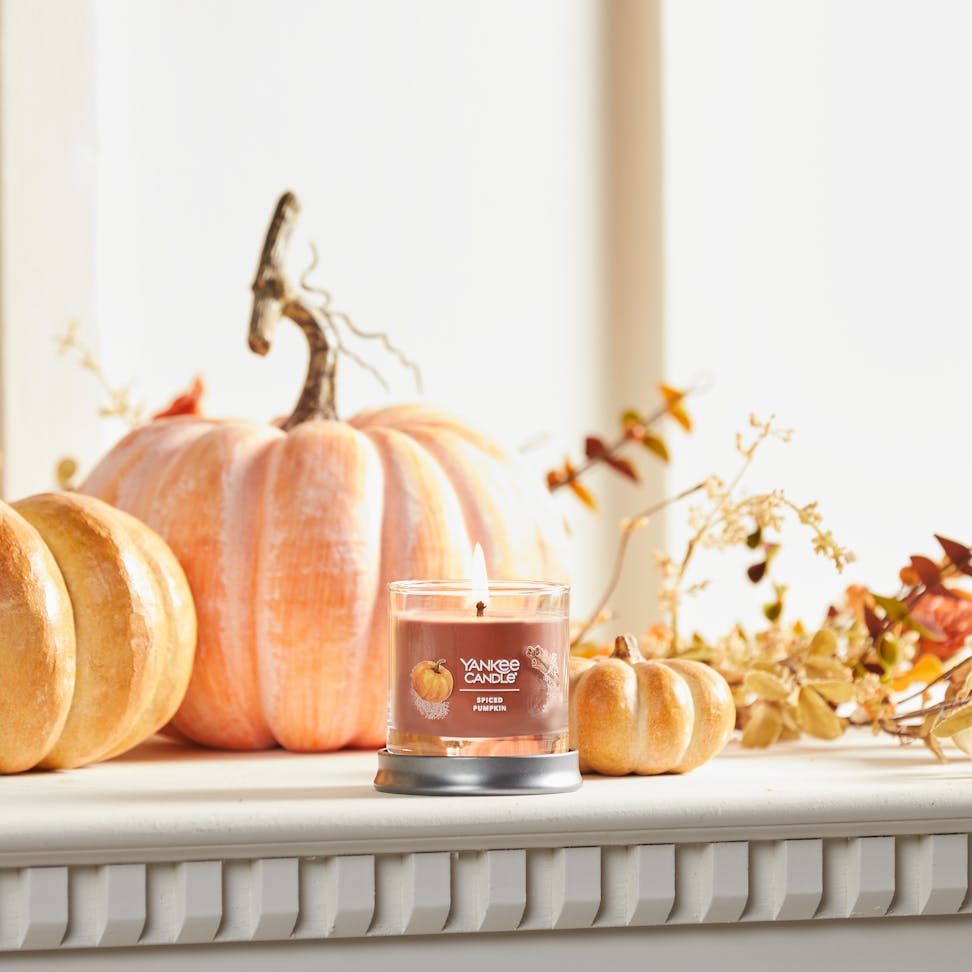 spiced pumpkin signature small tumbler candle on mantle