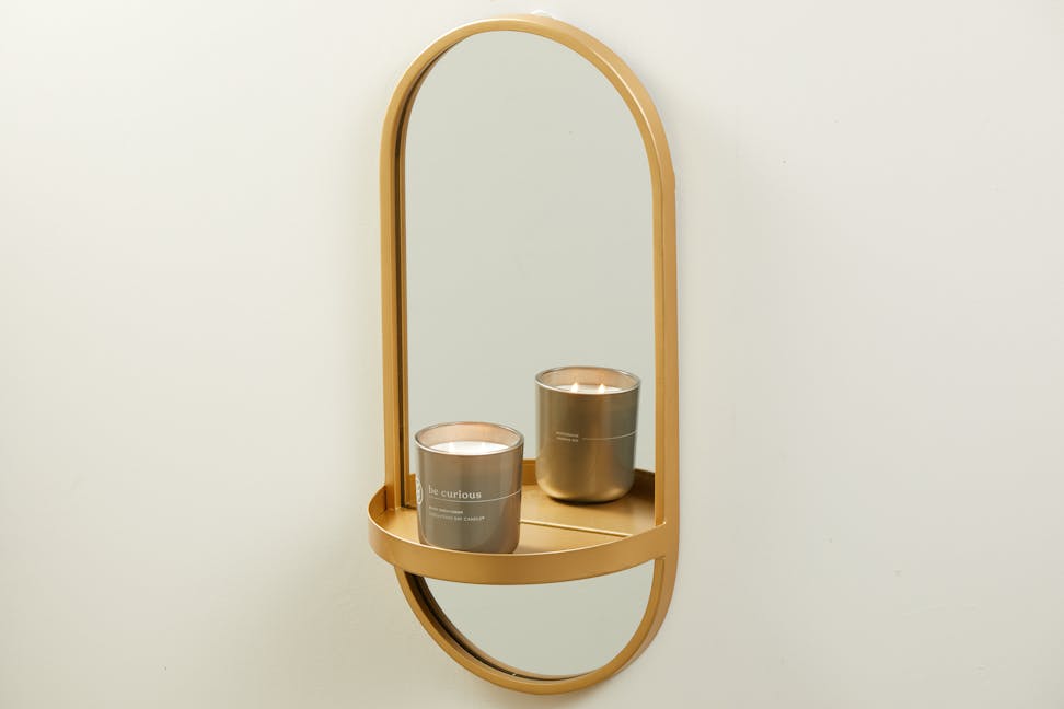 chesapeake bay candle intentions collection be curious black birch cedar medium two wick jar candle on a sconce