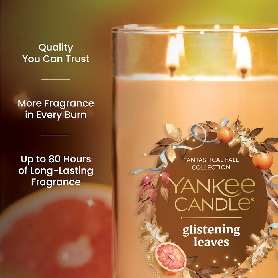 Large three-wick scented candle with fall leaves design, promises long-lasting fragrance and quality burn time.